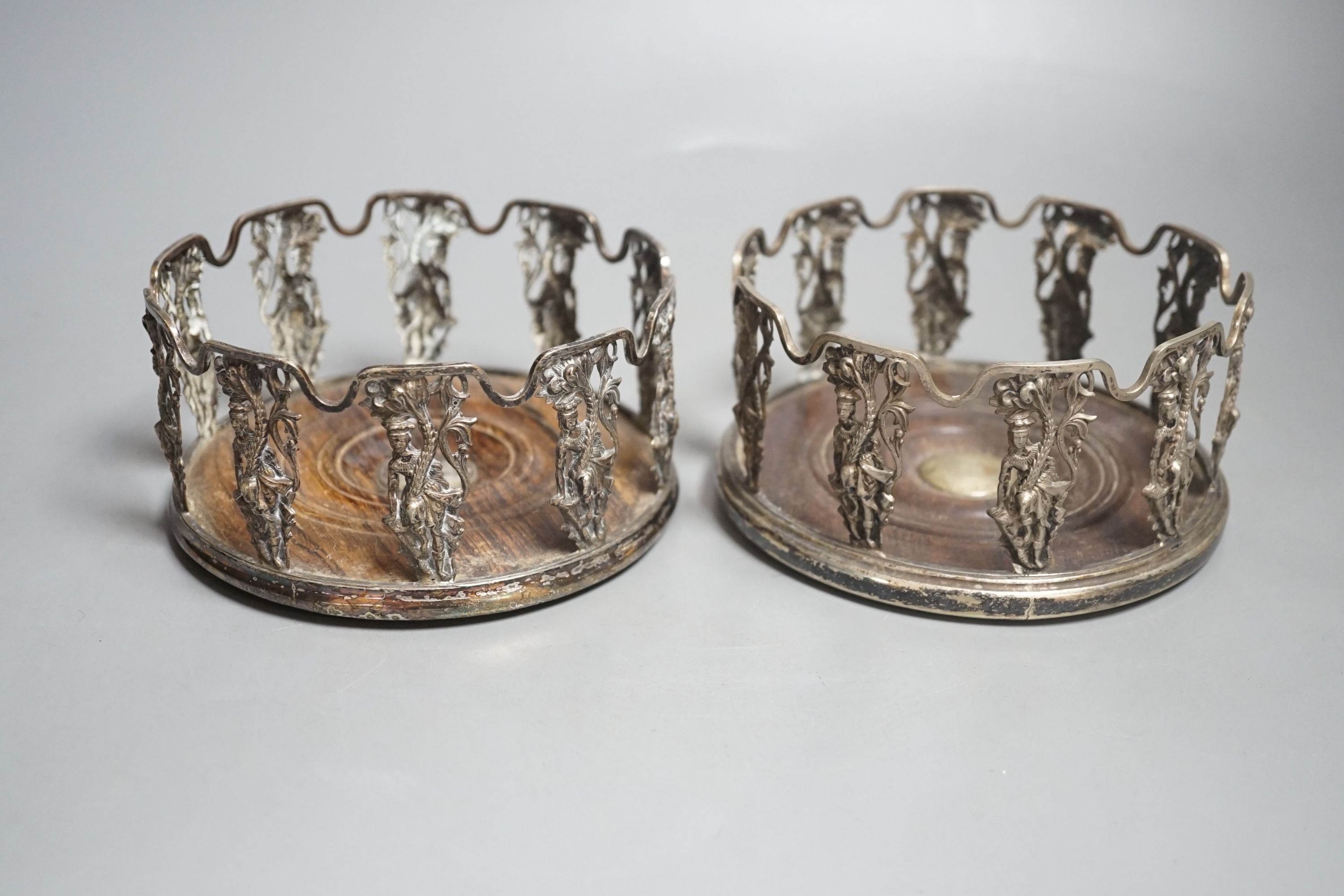 A pair of 19th century Anglo-Indian silver plated figural wine coasters.
